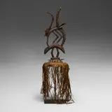 Bamana, Chi Wara (antelope headdress), carved wood, raffia, cord, wicker