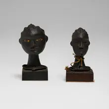 Anyang, Miniature ritual heads, set of two, antelope skin over carved wood, raffia