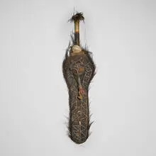 Flute mask by Biwat, carved wood with encrustation, shell, feathers, bone, sold Aug 2026