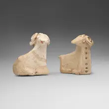 Khurvin, Reclining rams, pair, earthenware