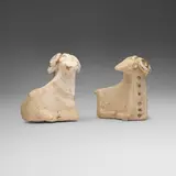 Khurvin, Reclining rams, pair, earthenware