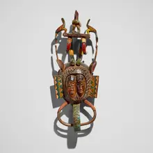 Guro, Janus mask, painted and carved wood, plant fiber