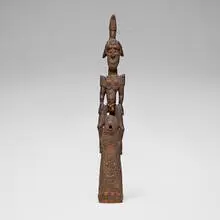 Sepik River, Figural trumpet or War-Horn, carved and painted wood, shells, beads, feathers, raffia, seed pods