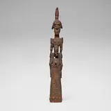 Sepik River, Figural trumpet or War-Horn, carved and painted wood, shells, beads, feathers, raffia, seed pods