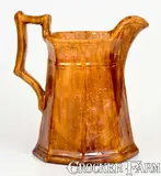 JOHN BELL / WAYNESBORO, Pennsylvania Redware Octagonal Pitcher by John Bell, circa 1850-1880, Redware, sold Apr 2022