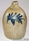 2 Gal. COWDEN & WILCOX / HARRISBURG, PA Stoneware Jug with Floral Decoration Inscribed "10 1/2" by Cowden & Wilcox, circa 1865, Stoneware, sold Aug 2021