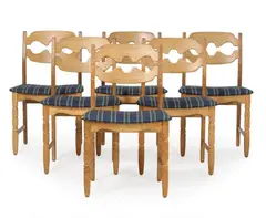 A set of six oak chairs, upholstered with blue striped wool by Henry Kjærnulf, sold Sep 2026