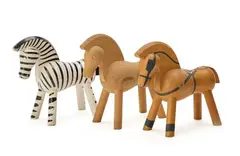 Three partially lacquered wood toy figures of in the shapes of a zebra and two horses by Kay Bojesen, sold Sep 2026