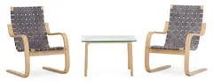 Pair of easy chairs and coffee table in birch by Alvar Aalto, sold Sep 2026