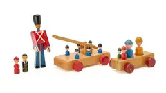A collection of lacqeured wooden toys, comprising a guard, a fire engine, a car and 12 figures by Kay Bojesen, sold Sep 2026