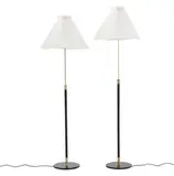 Aage Petersen, Two height adjustable black lacquered metal and brass floor lamps with white pleated paper shades