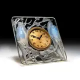 René Lalique (French, 1860-1945), An 'Inséparables' Clock, Designed 1926 by René Lalique, glass, frosted and polished, remnants of blue staining, moulded R, sold Feb 2024