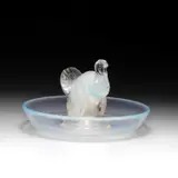 René Lalique (French, 1860-1945), A 'Dindon' Cendrier, Designed 1925 by René Lalique, glass, the central figure modelled as a turkey, etched R, sold Jan 2024