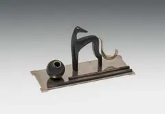 Writing set with pen tray, ink stand and dog by Hagenauer, brass, nickel plated, wood, patinated black; marked on the bottom with "SK" in a triangle (Salzburg collection), sold Dec 2024
