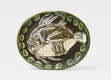 Pablo Picasso, Poisson fond noir, 1952, Oval ceramic plate. White clay with sculptural decor and black, green and blue engobe painting, partly glazed; ceramic, Madoura edition