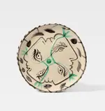 Pablo Picasso, Quatre profils enlacés, 1949, Ceramic plate. White clay with sculptural decor and black, green and blue engobe painting, glazed; ceramic, Madoura edition