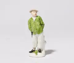 Peter Reinicke, A rare Meissen porcelain figure of a peasant in a green jacket