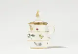 Meissen Royal Porcelain Manufactory, A Meissen porcelain lidded sauce pot with woodcut flowers and insects