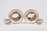Meissen Royal Porcelain Manufactory, A pair of Meissen porcelain cups and saucers with landscapes