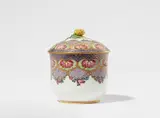 Sèvres, A Sèvres porcelain sugar box "en frises colorées", Bouret model with floral finial. Blue enamel marks: Conjoined double L around the year letter n, painter's mark comma, incised circle. A