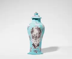 Cornelis Funcke, A Berlin faience vase and cover with Chinoiserie decor, Slender baluster-form vase of octagonal section with original cover. Rim chips, a glaze chip to the finial