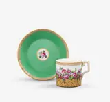 A KPM Berlin porcelain cup in the form of a rose basket and saucer by Königliche Porzellanmanufaktur Berlin Kpm, sold Apr 2026
