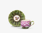 Königliche Porzellanmanufaktur Berlin Kpm, A rare KPM Berlin porcelain cup in the form of a rose and saucer with leaves in relief