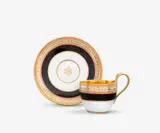 A KPM Berlin porcelain cup and saucer with black segments by Königliche Porzellanmanufaktur Berlin Kpm, Model no. 1308, with gilt interior. Blue sceptre mark with enamel blue dash above, press marks. Minor wear to the gildin, sold Apr 2026