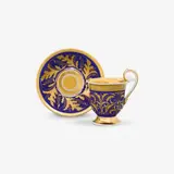 Königliche Porzellanmanufaktur Berlin Kpm, A KPM Berlin porcelain cup and saucer with holly motifs