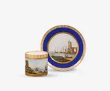 Königliche Porzellanmanufaktur Berlin Kpm, A KPM Berlin porcelain cup and saucer with merchant scenes