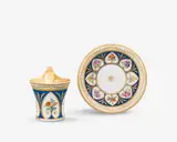 Königliche Porzellanmanufaktur Berlin Kpm, A KPM Berlin porcelain cup and saucer with flowers in heart-shaped reserves