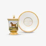 Königliche Porzellanmanufaktur Berlin Kpm, A KPM Berlin porcelain cup with a rearing horse and saucer