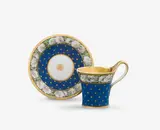 Königliche Porzellanmanufaktur Berlin Kpm, A KPM Berlin porcelain cup and saucer with starry night decor and camelia wreaths