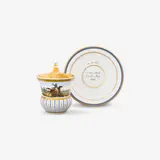 Königliche Porzellanmanufaktur Berlin Kpm, A KPM Berlin porcelain cup with a rider and saucer inscribed "bis zum Tode"