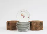 14 Berlin KPM porcelain dessert plates in two boxes by Königliche Porzellanmanufaktur Berlin Kpm, sold Jun 2025