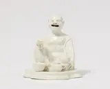 A Meissen porcelain figure of a crouching budai with a tea set by Meissen Royal Porcelain Manufactory, sold May 2025