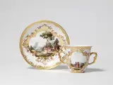 A Meissen porcelain beaker and saucer with landscape decor by Meissen Royal Porcelain Manufactory, sold May 2025