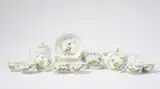 A Meissen porcelain coffee and tea service with exotic birds in trellises by Meissen Royal Porcelain Manufactory, sold May 2025