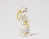 A Nymphenburg porcelain model of a putto as Fortuna by Nymphenburg, sold May 2025