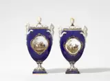Johann Carl Schönheit, Two Meissen porcelain pot-pourri vases with snake handles and courtly riders