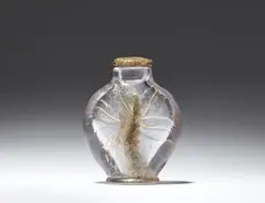 Émile Gallé, An etched glass bottle and stopper with lily motifs by Emile Gallé