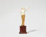 Ferdinand Preiss, A chryselephantine figure of Salomé dancing, Ivory with minor polychromy, two small faceted red garnets, gilded bronze/metal, red marble base. Unsigned. One index finger lost. H