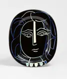 Visage de Femme by Pablo Picasso, 1953, Ceramic plate. White clay, black, blue and green engobe painting, with incised decor, glazed; ceramic, Madoura edition, offered Dec 2023