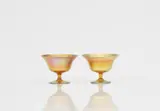 Louis Comfort Tiffany, A pair of favrile glass stembowls
Louis Comfort Tiffany, New York, around 1900.