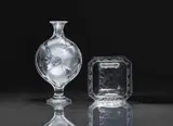 Lalique Verrerie, A Flacon Moulin Rouge vase
Lalique, Wingen-sur-Moder, 1980s to early 2000s., Clear mould-pressed glass, patinated. Etched signature Lalique France. Without stopper. H