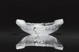 Lalique Verrerie, A cendrier Nancy ashtray
Lalique, Wingen-sur-Moder, 1980s/1990s., Clear mould-pressed glass, patinated. Etched signature Lalique France. H 6.6, W