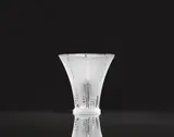 Lalique Verrerie, A Vase Epis
Lalique, Wingen-sur-Moder, designed in 1931, produced 1990s/early 2000s., Clear mould-pressed glass, patinated. Etched signature Lalique ® France. H 16.5, D