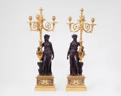 Pierre Philippe Thomire, A pair of sculptural ormolu candelabra
after a model by Clodion