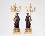 Pierre Philippe Thomire, A pair of sculptural ormolu candelabra
after a model by Clodion