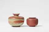 Otto Lindig, Two brown glazed ceramic vases by Otto Lindig, Red earthenware, interior glazed white, salt glaze. Incised with conjoined OL monogram, one with additional incised dash. H 8.8 and
